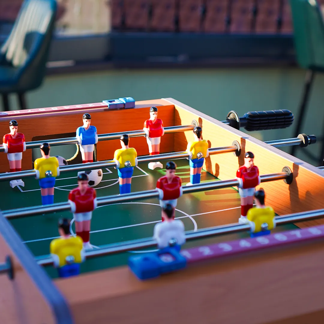 Foosball table on the rooftop at sunset